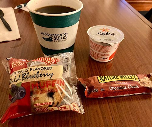 COVID breakfast bag with muffin, yogurt, and granola bar. 