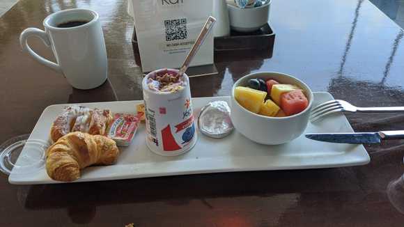 This was the Tit breakfast being offered by the Sheraton Waikiki in Sept when they removed the buffet breakfast.  Pastry, yogurt and fruit plus coffee/tea/juice (plus one day, they had no yogurt)!  I understand that what they were offering before they had to close the buffet was pared back but included some hot options. 

How would you describe this breakfast. :)