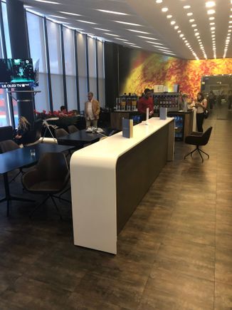 SVO Main lounge area yesterday, out of shot is the food counter and a manned bar. The food consisted of 3 hot choices, one of which was chicken liver noodles, the second was chicken drumsticks and the third was vegetarian. All in all a fairly un remarkable lounge. Wine vending machine was novel though. 