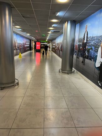 Corridor after passport control to baggage hall