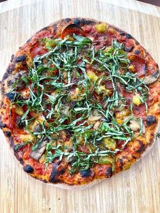 Mushroom, pepperoni, green chili, and basil pizza. 