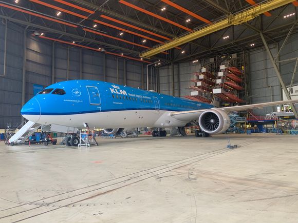 A KLM 787 inside their maintenance hangar.  Check out the cool structure for working on the tail in the back!