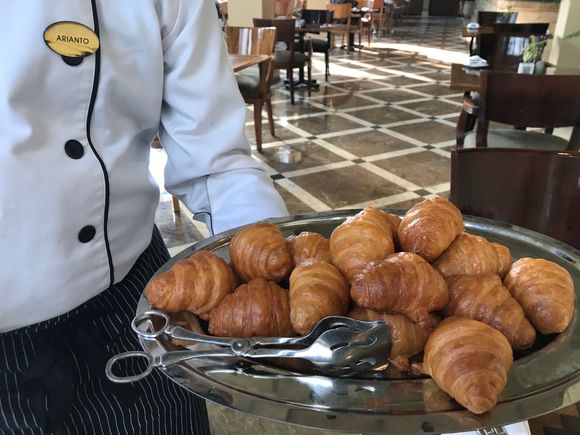 Chef Arianto doing his daily rounds with fresh croissants and pain au chocolat