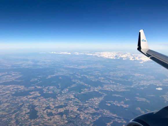 Blue skies with a few clouds somewhere
