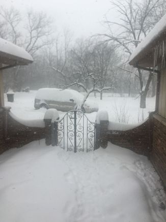 I live about 19 miles SSW of MDW. This is a picture taken Friday out my front door, and we had at least 3 more inches after this. 