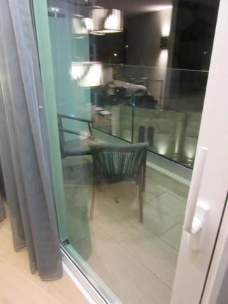Small outdoor balcony -- there is no way to turn off the balcony light at night however there the blackout curtains mostly did their job
