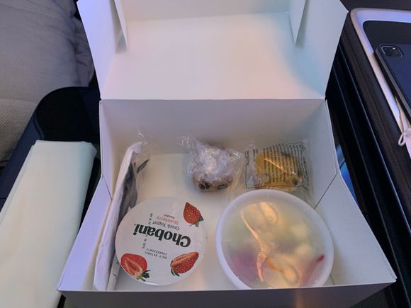 Breakfast box - yoghurt, fruit, tiny muffin and something else, I didn’t eat it.  