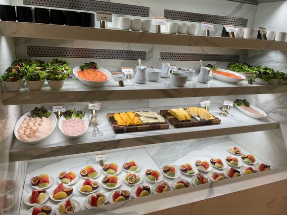 Cold case with yogurts, fruit, smoked salmon, sliced meats and cheeses, etc.