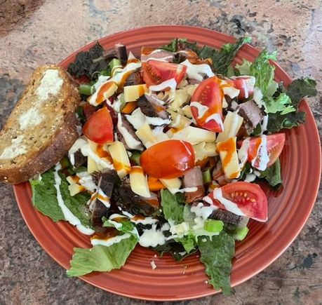 Leftover flank steak salad with a little French and Ranch and a slice of La Brea multi- grain toast. 