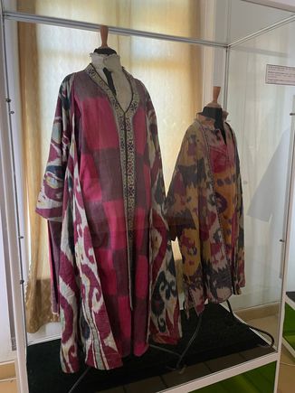 There are many displays of traditional clothing, carpets, china, and more
