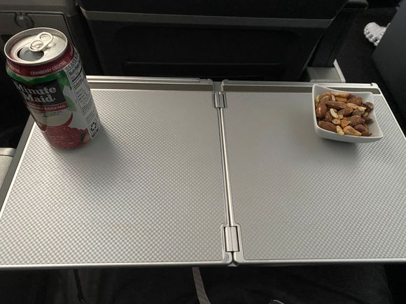 Cranberry-apple juice & some warm nuts.    The pistachios left a little to be desired.   (I eat a lot of pistachios & am discerning in how they taste)