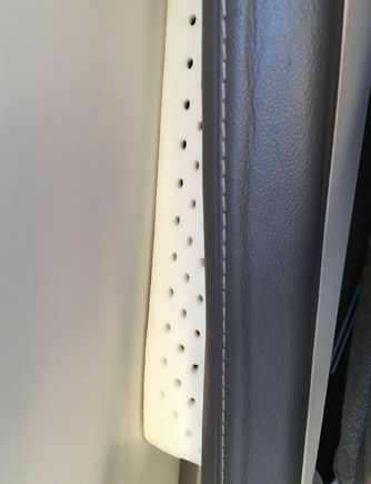 Arm rest and fuselage wall.