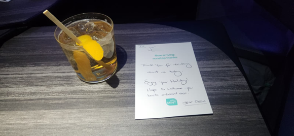Woodford & soda with orange zest (a surprisingly nice touch and not something I ever thought to try) and a nice note from the crew. The two Mint crewmembers were the same as my last flight, but the note was handed to me by one of the FAs from the back!