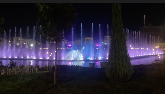 The ballet was taking place behind the water. On the other side there are seats.
