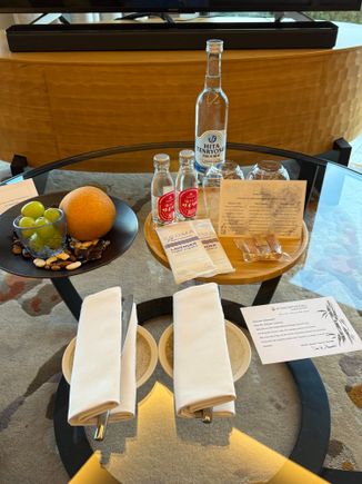 Some fruit, water, cider, and snacks.