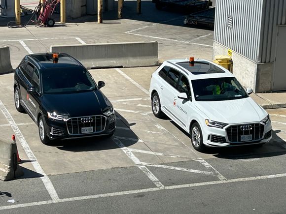 Not too busy today. Driver of the black car is sitting in the white car chatting to the other driver. 