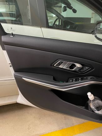 Driver Door Panel - it holds a 1L bottle easily. 