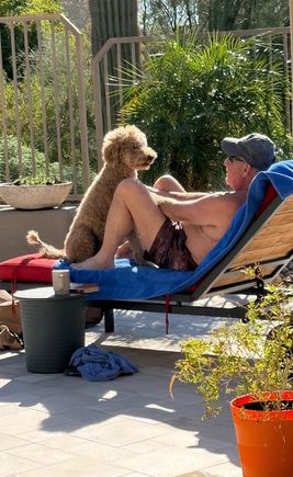 Poppy is being a good hostess for a visitor from the frigid Midwest. 
