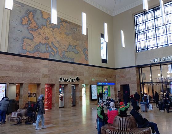 The main hall of Cornavin train station in Geneva - the doorway-like openings used to be ticket counters 