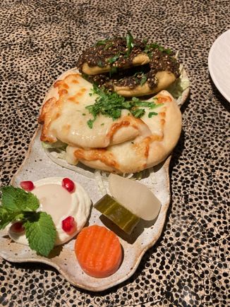 MAN’OUSHIT ZAATAR (v) £12 Our special cheese mix with sesame
140 kcal