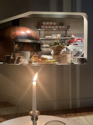 Looking into kitchen with pizza oven