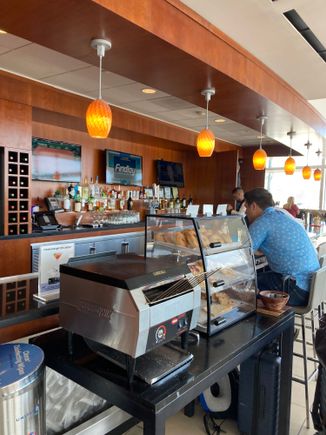 The bar area has a mobile toastière and bread display