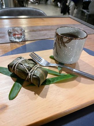 Sweet rice with red bean wrapped in a lotus leaf