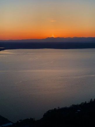 Sun dips behind the Olympic Mountains  04/09/20