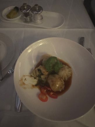 Vegetable dumplings with one cut open to see inside. Supposed to be with spicy garlic sauce. It was spicy but I wouldn’t say it was garlic. 