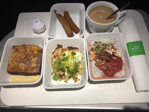 Clockwise from top middle - dry chicken sausage, cold cappuccino, chia seed pudding, bacon potato hash brown, and stuffed french toast