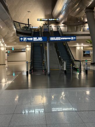 Follow the signs to the airport railway from inside the terminal and then signs to long term parking. You should be walking away from the airport. 
