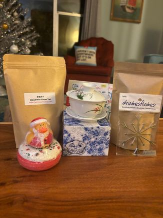 I got my second Secret Santa gift today. Thank You JSDS for the wonderful gifts. I have never had a gaiwan before and can’t wait to use it with the teas. Love the ornament is named after the town I live in. What a cute bath bomb. I love baths  