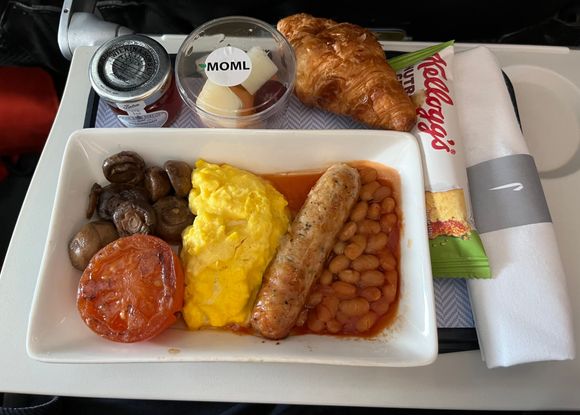 Muslim meal. Eggs were a bit dry. The sausage was the star. Best I’ve had on a plane. Very flavourful. 