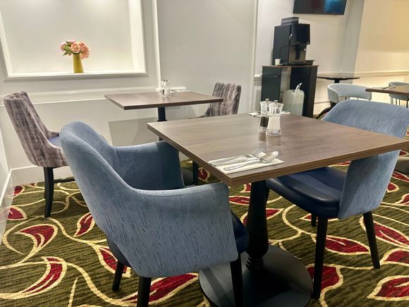 Restaurant seating has been replaced with new cloth chairs