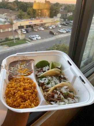 Casa de Mexico, seen in the background, small strip mall next door.