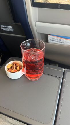 From last month: 
8/9/2025 SBA-DEN 
UA 2638 
737-800
Wow! Updated NEXT interior cabins on the 737-800 are quite nice, and boy are they long overdue. 
Anyway, decent flight from DEN-SBA. No pre-order options on this route. After takeoff, drinks of choice and nuts were served, along with two lunch offerings: ravioli or enchiladas. Went with the ravioli, which were fine, but I can’t help but laugh at the orange juice in the plastic cup in lieu of a salad or fruit on this flight! 