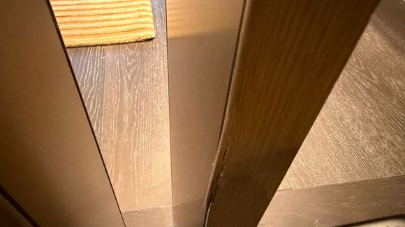 This is not very obvious and definitely once you see it!  On the right, the door to the bathroom had the metal end piece covering the cut end of the wood but on the left the cut end of the wood is exposed from the metal.