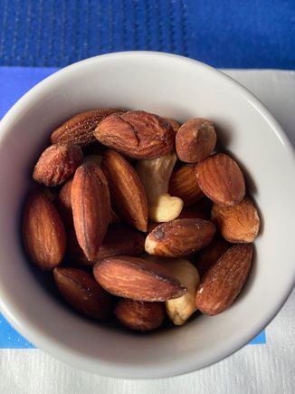 Nuts were lukewarm, and except for two cashew fragments were all almonds.  I was still grateful to have them, because as soon as they were served we hit heavy turbulence and had to delay the rest of the meal service.