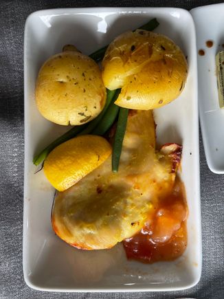 Undercooked potatoes; overcooked chicken and lemon, mystery sauce that looks like head cheese.