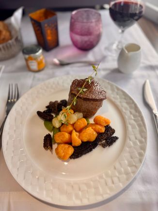 Grilled beef tenderloin with morel jus sweet potato gnocchi and sautéed vegetables

One of the better steaks I’ve had onboard QR - 9/10