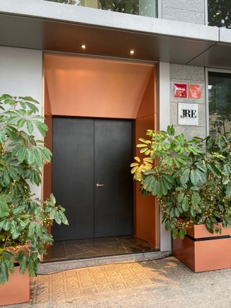 Streetwise entrance to Quirat : hotel guests can walk through the lobby and restaurant Arrel to reach Quirat confy indoors