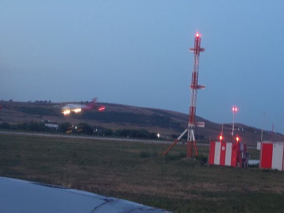 we held short of runway for quite some time, as this freigher(?) Saab came in.