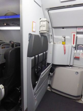 Two more cabin crew seats opposite the galley