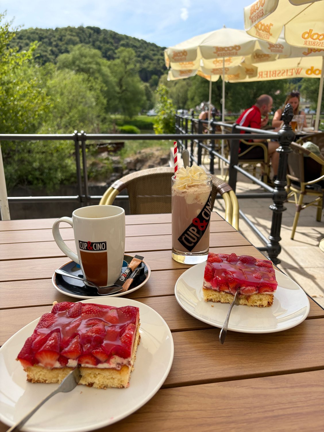 A busy cafe, tucked away in the back street on the river