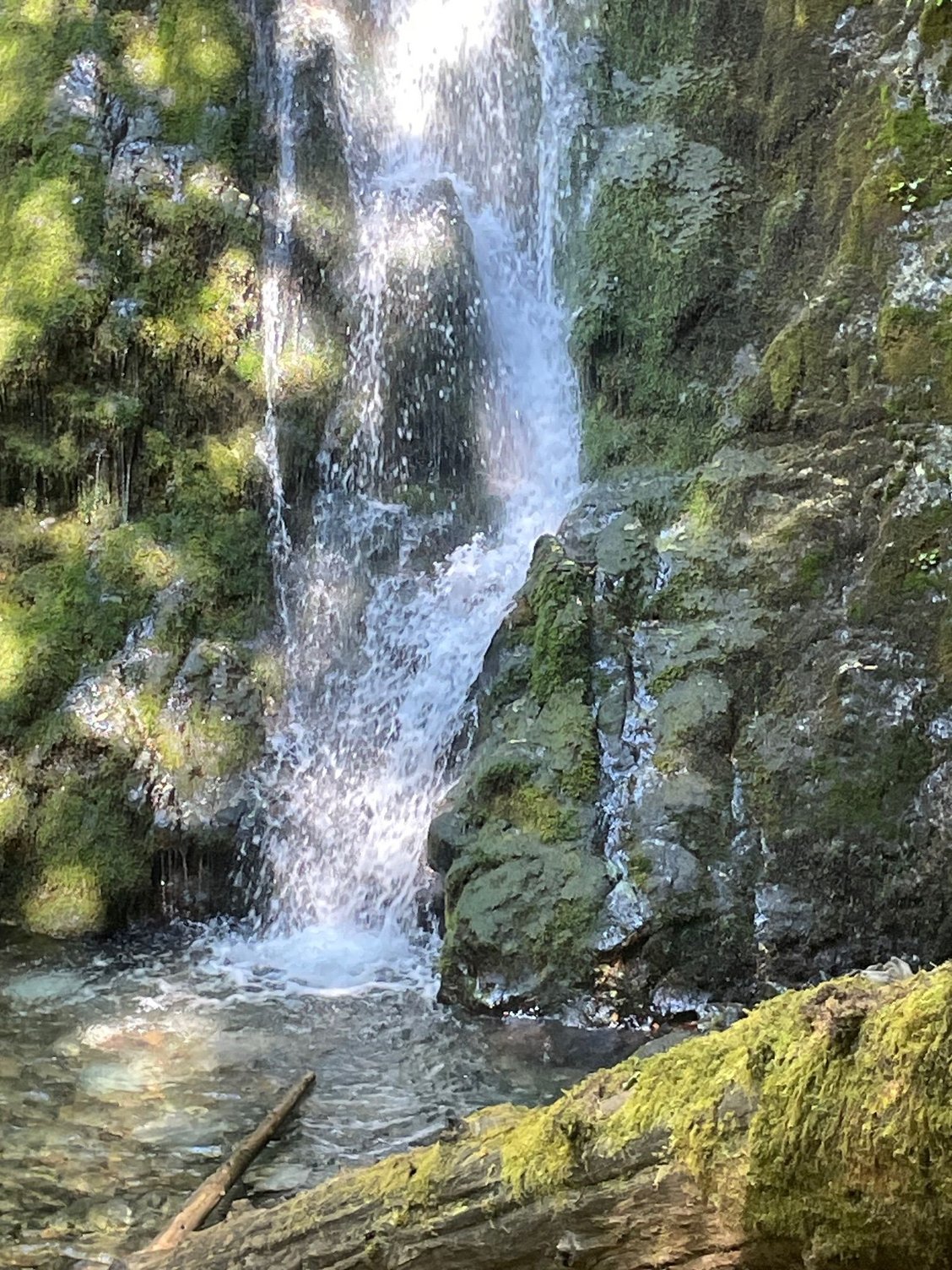 Another falls shot. A lot of people standing in the pool for pictures.