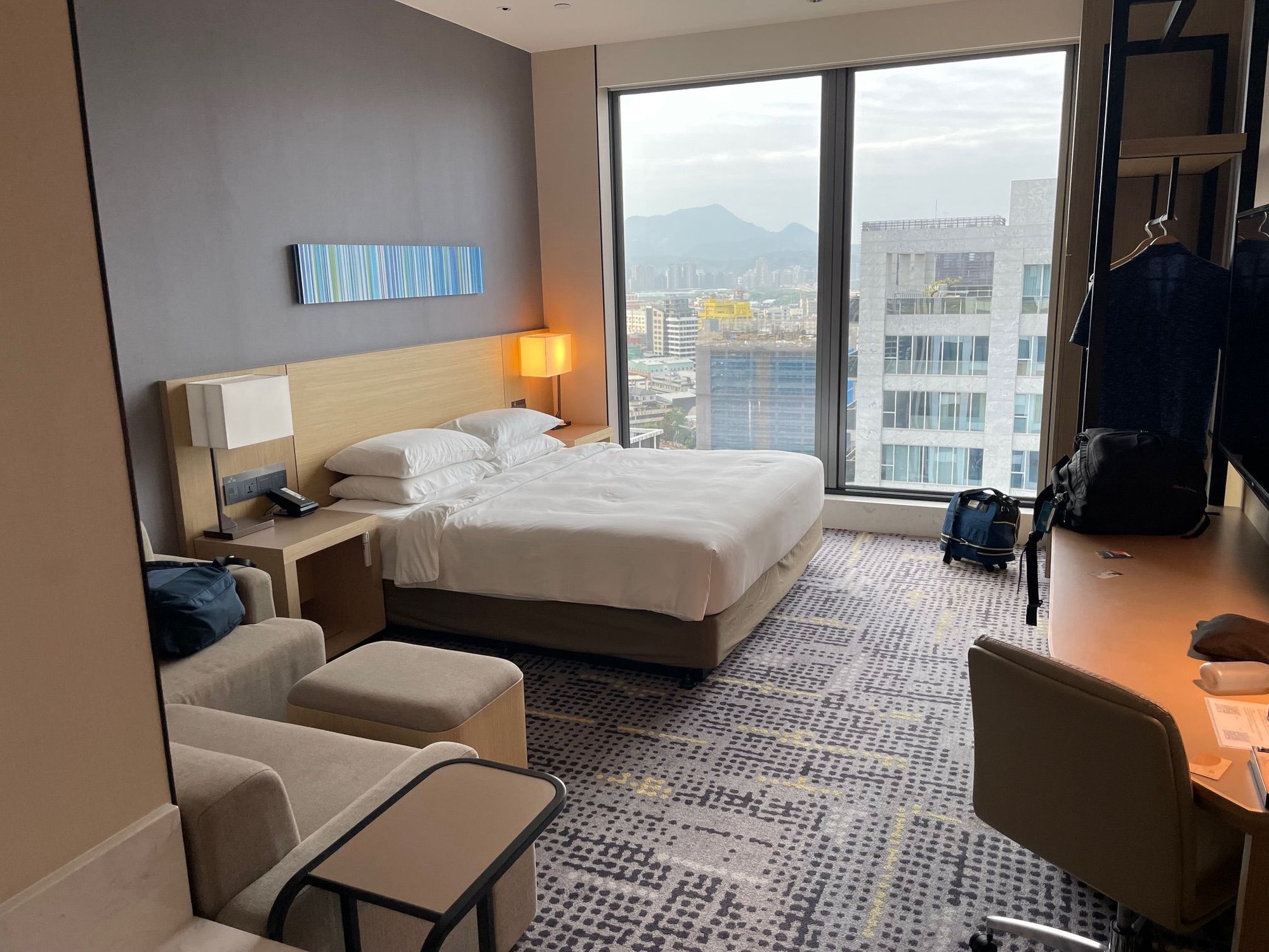 Our room with a giant picture window. Note in the bathroom, we dont provide any amenities, but we will happily sell you some at the front desk. See what I mean about transactiona.