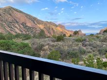Room as a spacious, private balcony which faces west for the sunsets.