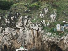 I think this may be the entry to the Blue Grotto! I just remember the narrator mentioning it when we passed a hole that was impossibly small! 