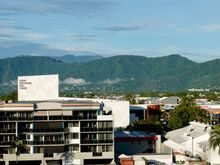 Cairns surrounded by green mountains 