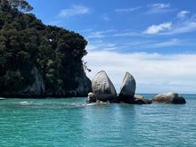 The boat ride to Apple Tree Bay passes by the prominent Split Apple Rock. According to Maori legend, it was sliced in half by two feuding gods. 